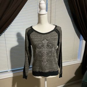 Miss Me long sleeved top with rhinestone appliqué cross design. 60%poly40%cotton